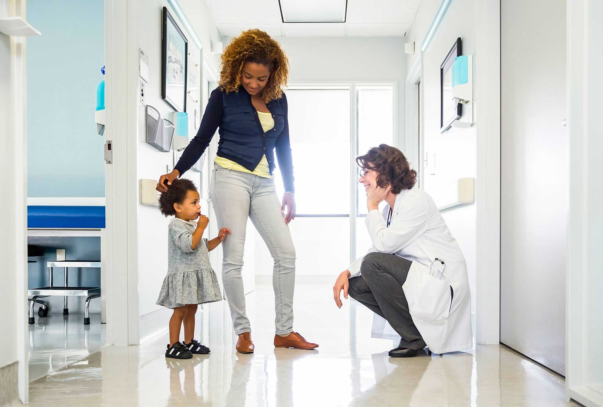 family-in-hallway-with-doctor